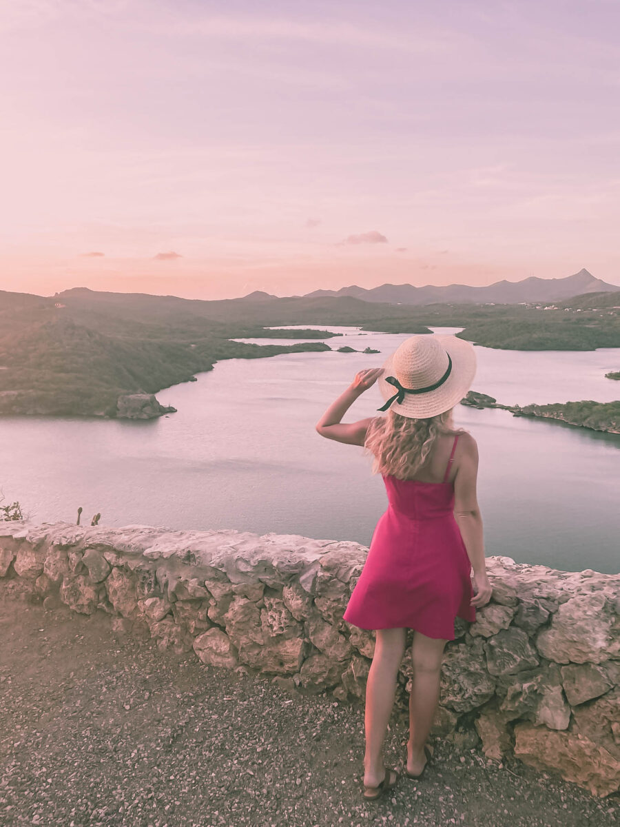 stunning sunset view with author in pink dress at santa martha viewpoint