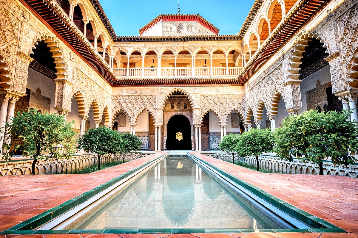 amazing real alcazar de sevilla from the inside with a nice water pool that needs to be on every persons 3 days in sevilla itinerary
