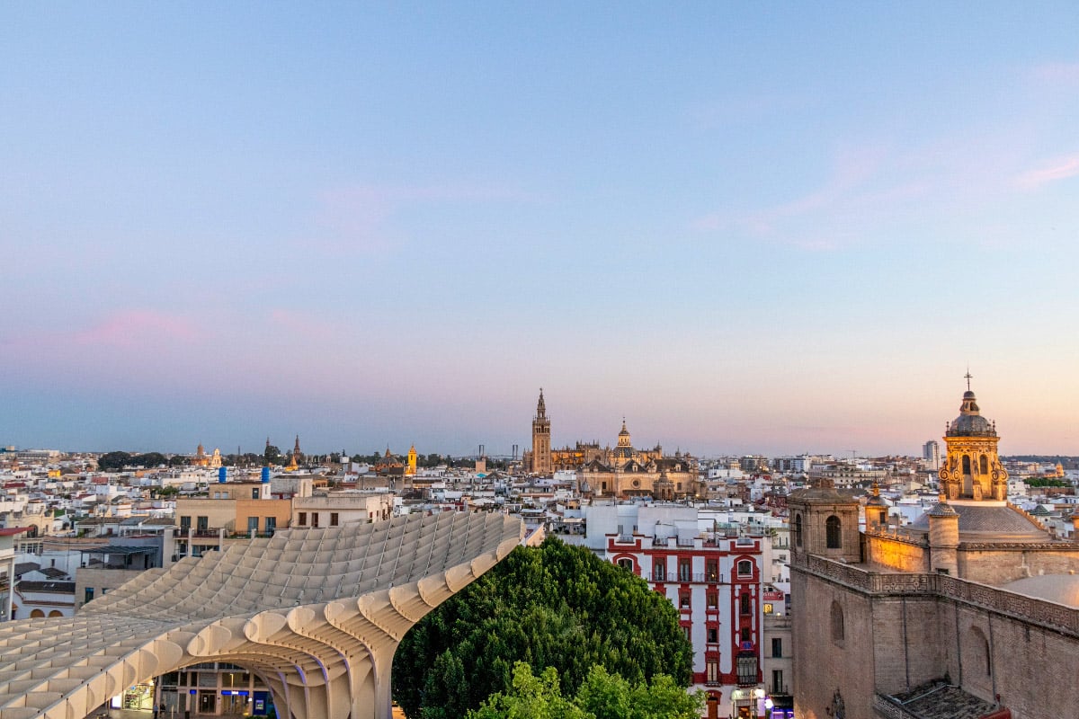 amazing view of las setas in sevilla from top of the sculpture over the city in the evening as the sun sets 