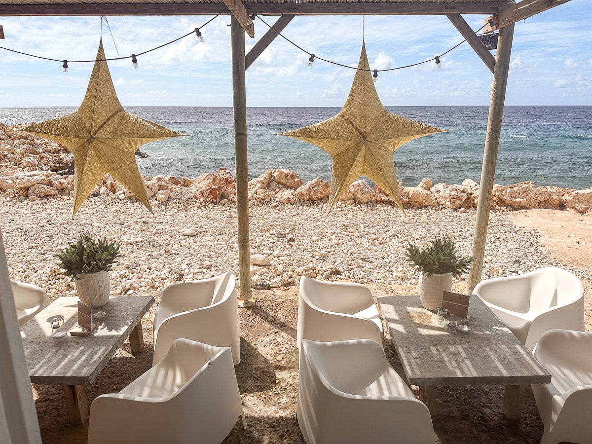 cute restaurant with tables at the oceanfront in willemstad