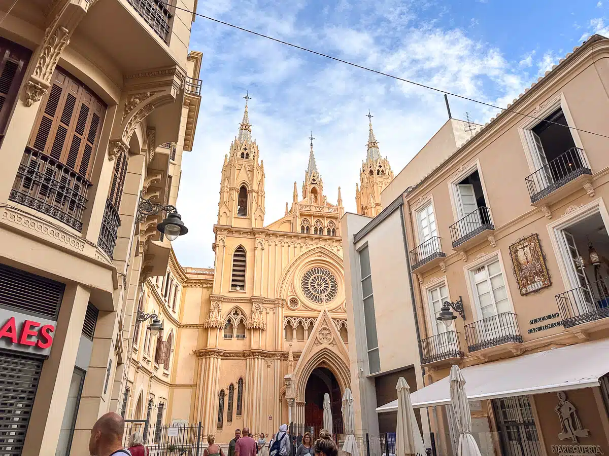 The narrow streets of Málaga’s Centro Histórico, with the impressive gothic façade of the Cathedral peeking out at the end. This is one of the best spots you need to put on your 1 day in Malaga itinerary.