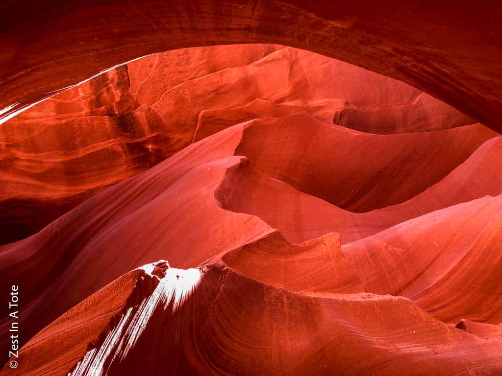 stunning picture of red antelope canyon in the us in orange hues and some sunshine coming in 