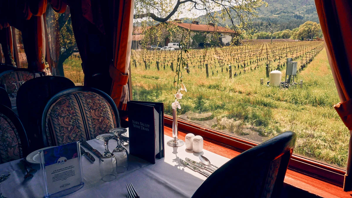 cute wine train going through vineyards in napa valley california one of the best bucket list experience sin america