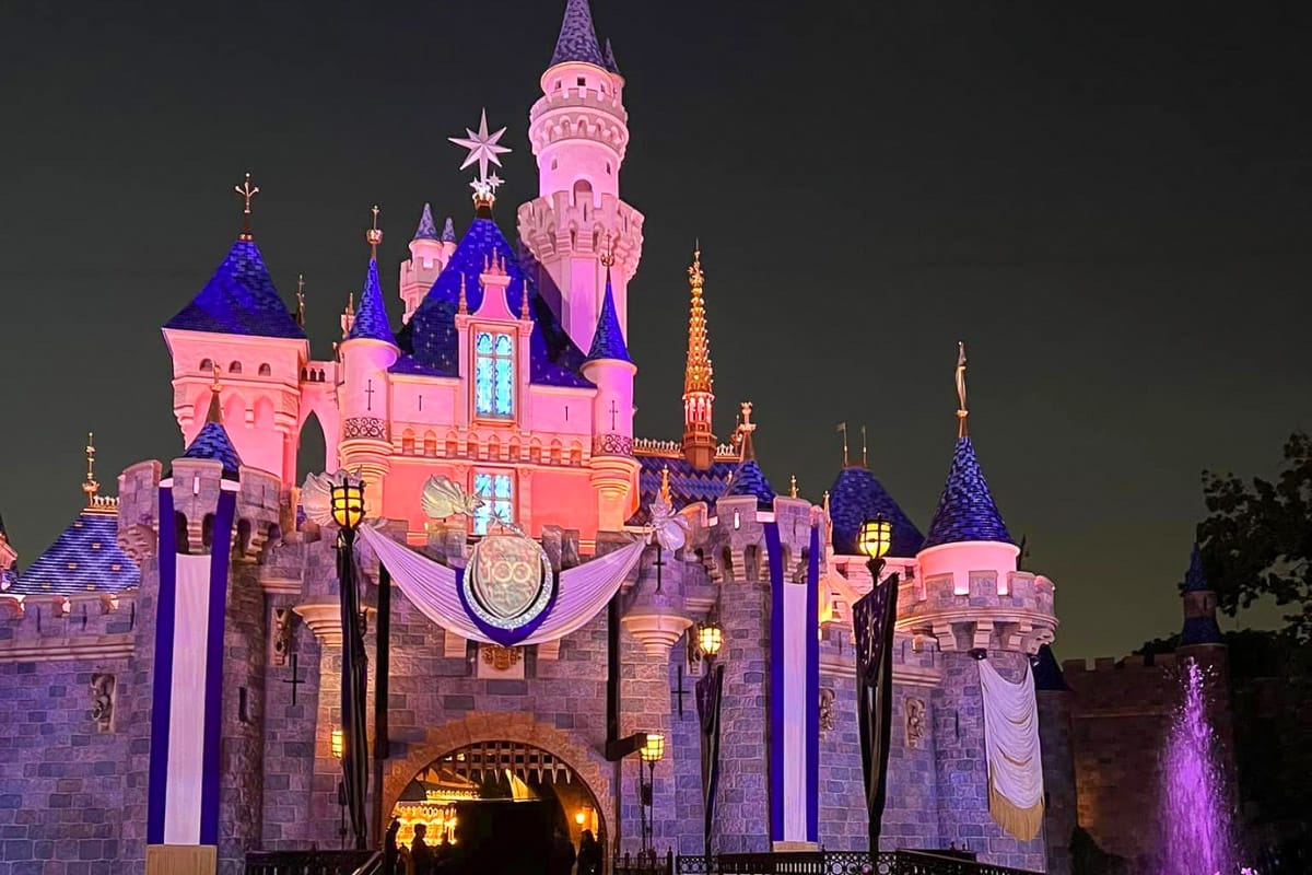 disneyland california castle in pink light at night one of the bucket list places in the us you should see