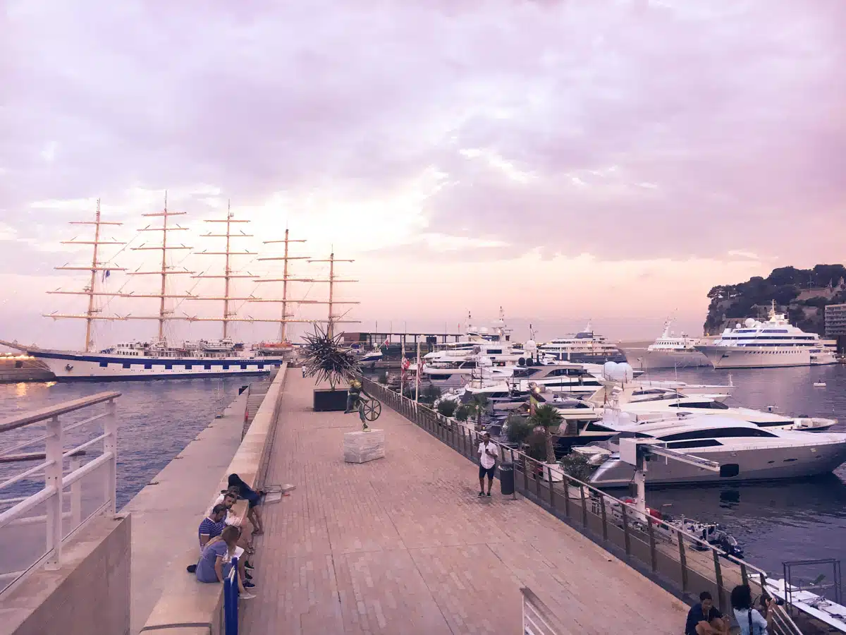monte carlo yacht port with lots of smaller yachts at sunset 
