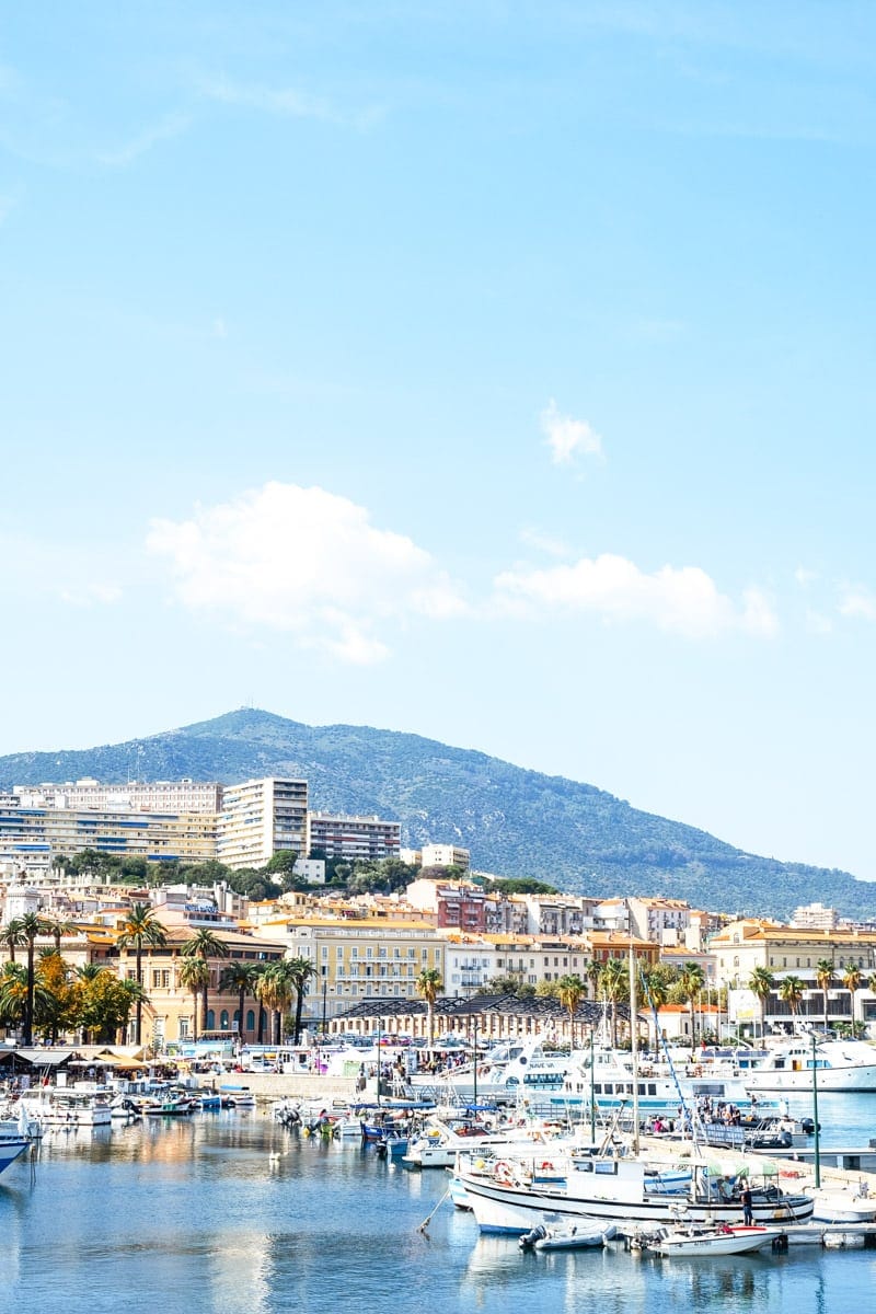 beautiful city center of ajaccio, corsica from the shore with boats in front
