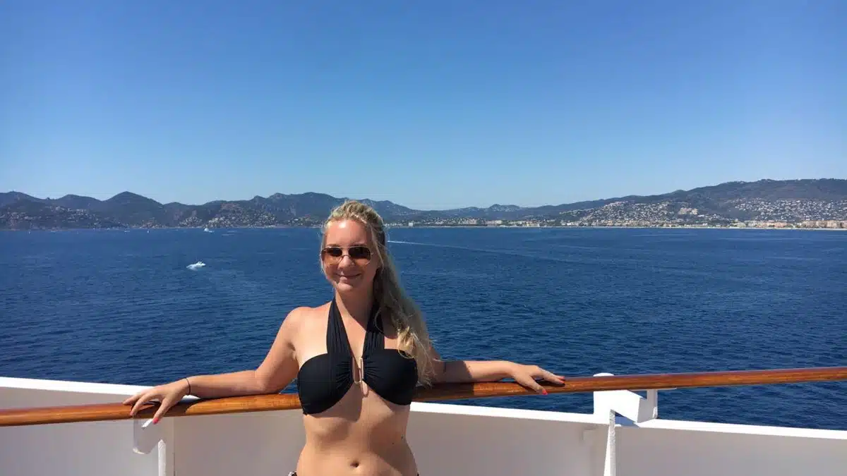 the author on a boat in cannes in front of the blue mediterranean sea
