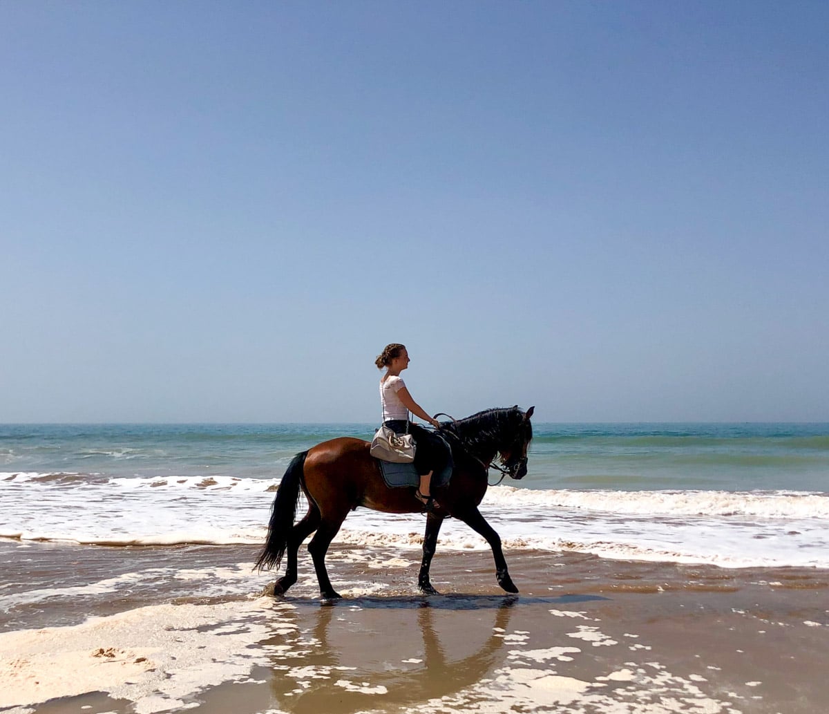 The author riding her horse in Essaouira in Morocco