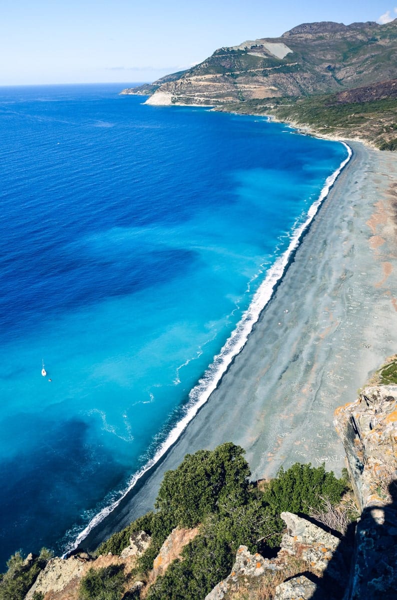 Original pebble Nonza Beach on the west coast of Corsica, France, during the late summer day