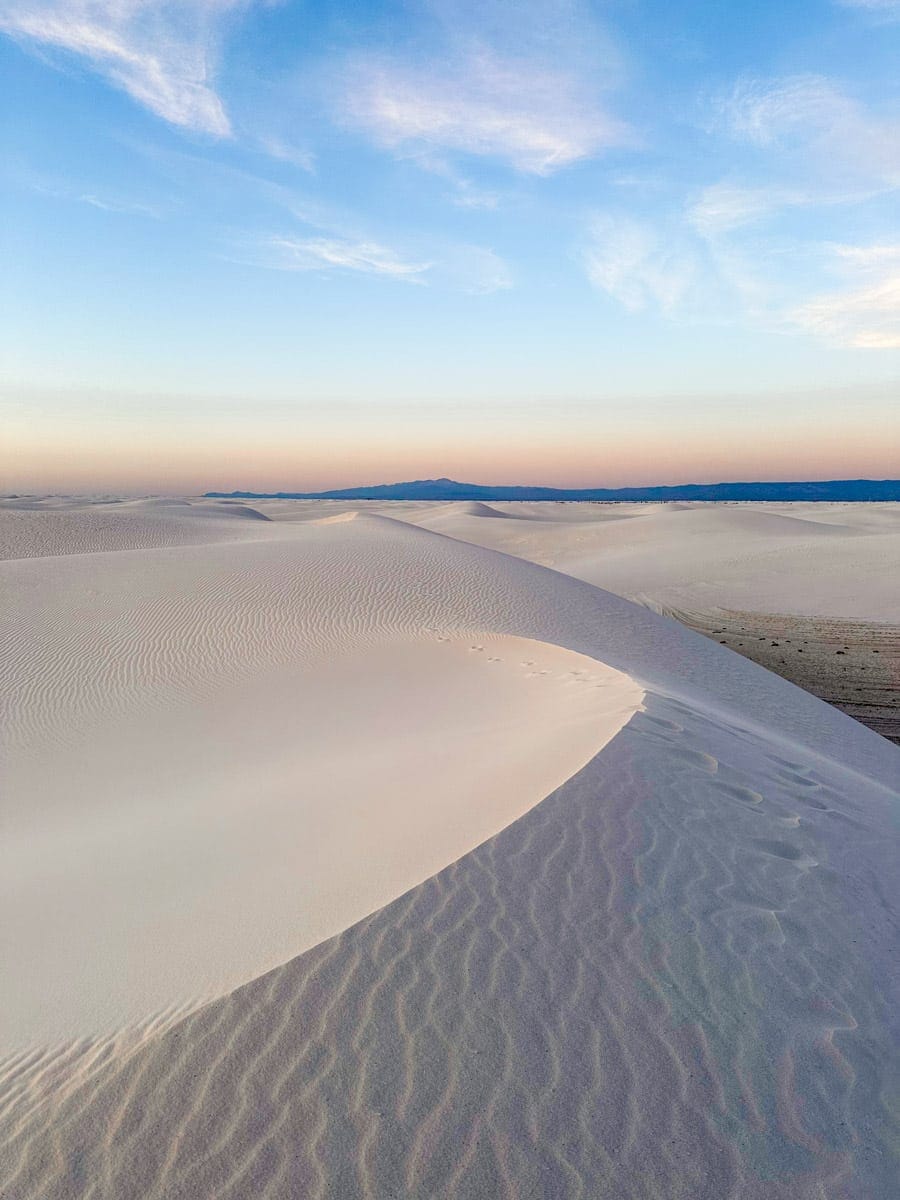 stunning picture of the white sand dunes at the national park at blue hour