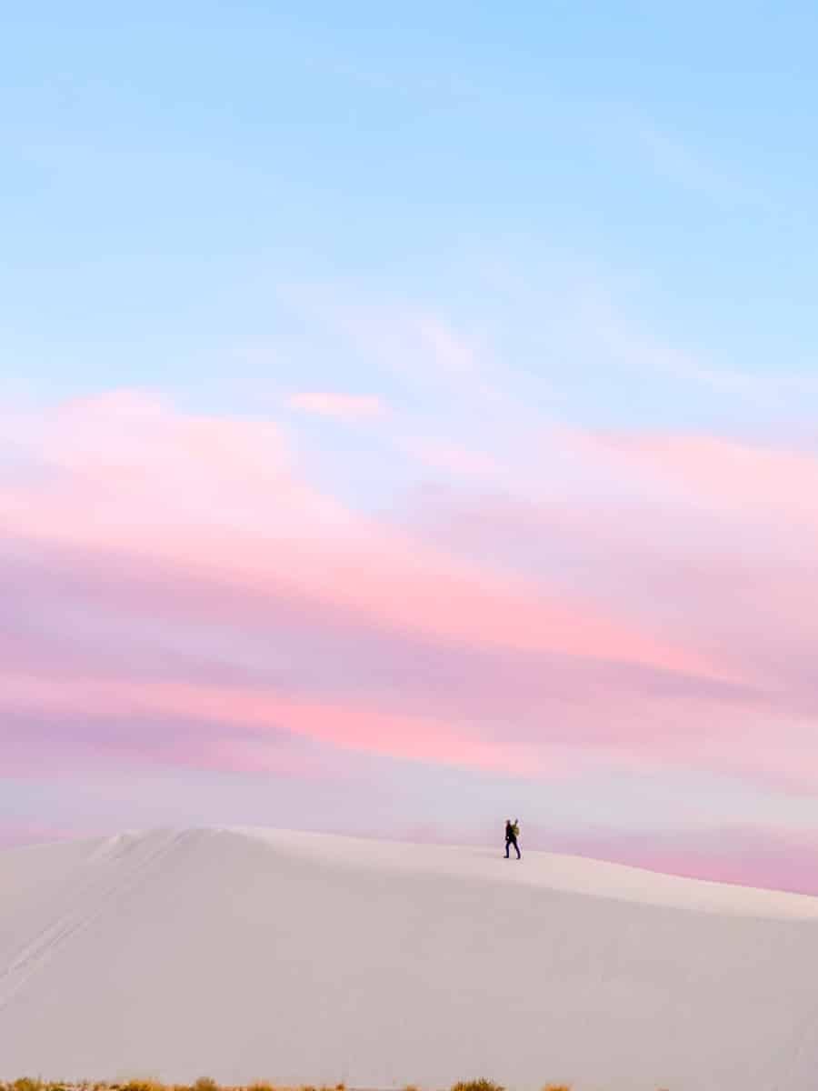 the author walking in the white sands in the evening