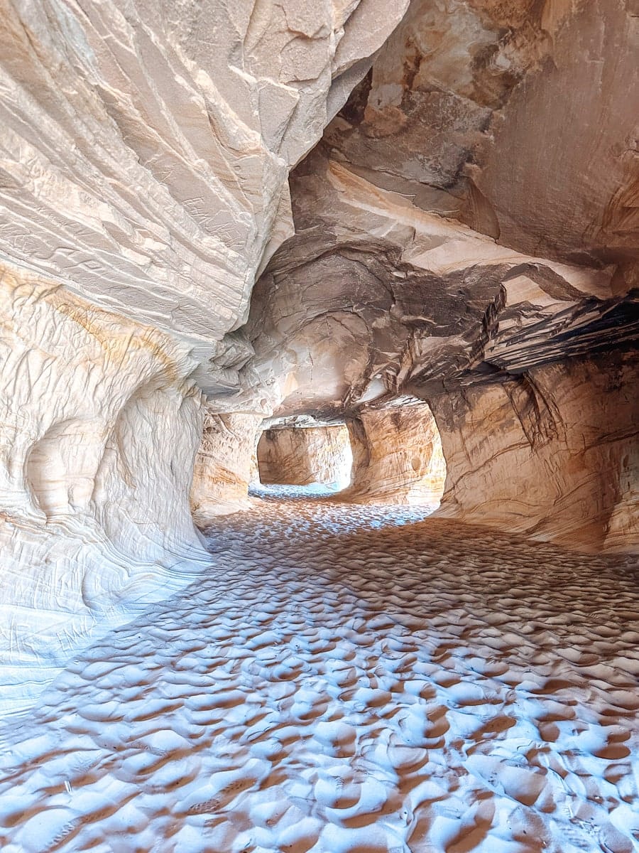 kanab sand caves with lots of footsteps in the sand