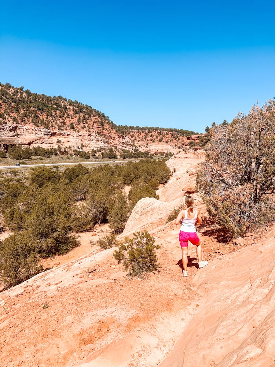 the author's wife posing on a hiking trail in kanab, utah