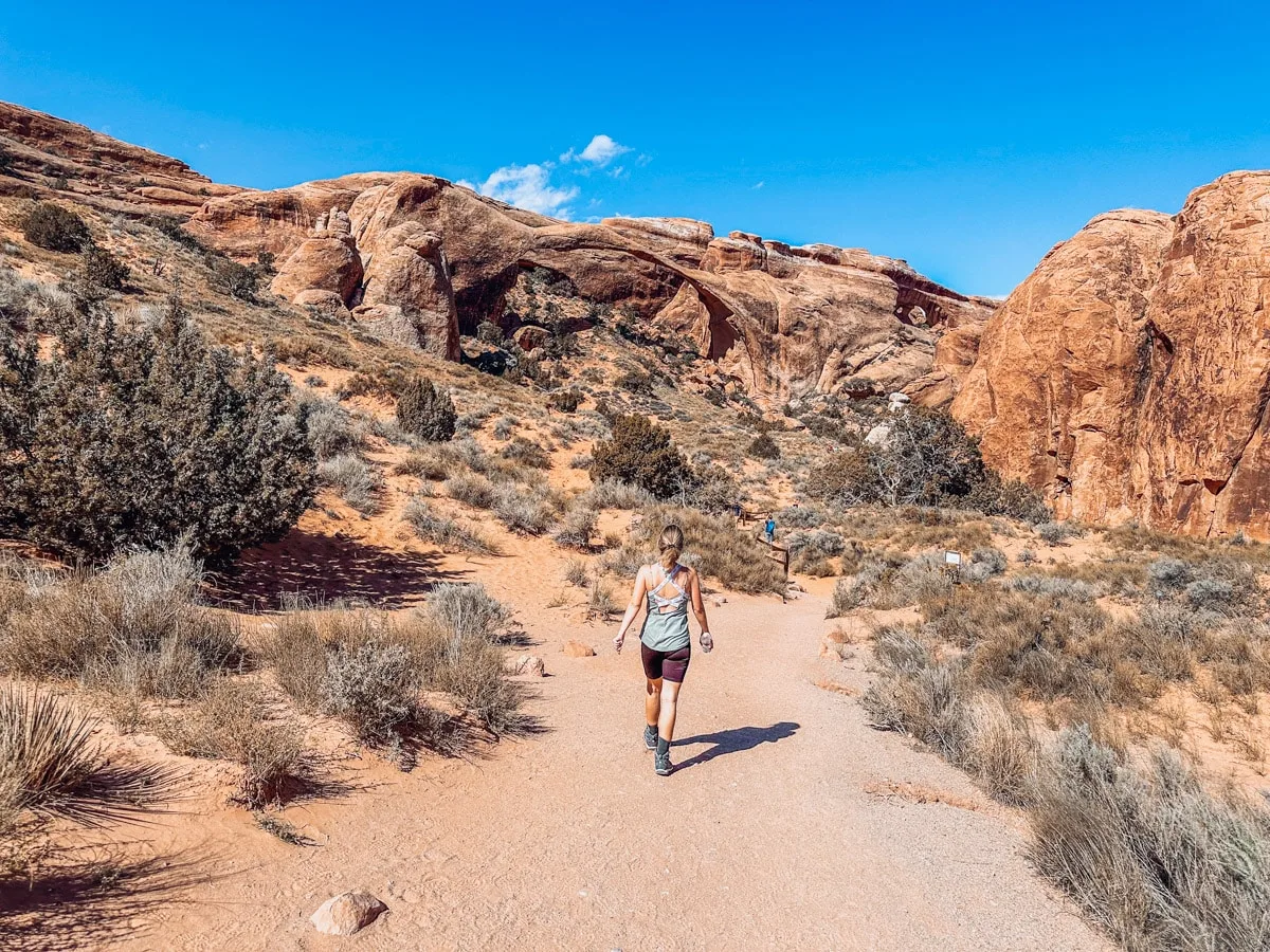 the authors wife in a sporty outfit hiking in moab