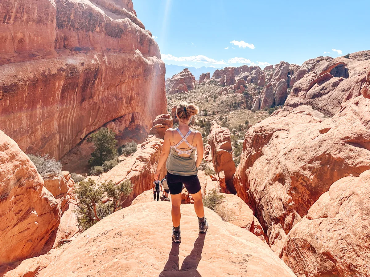 the author's wife posing on the devil's garden trail