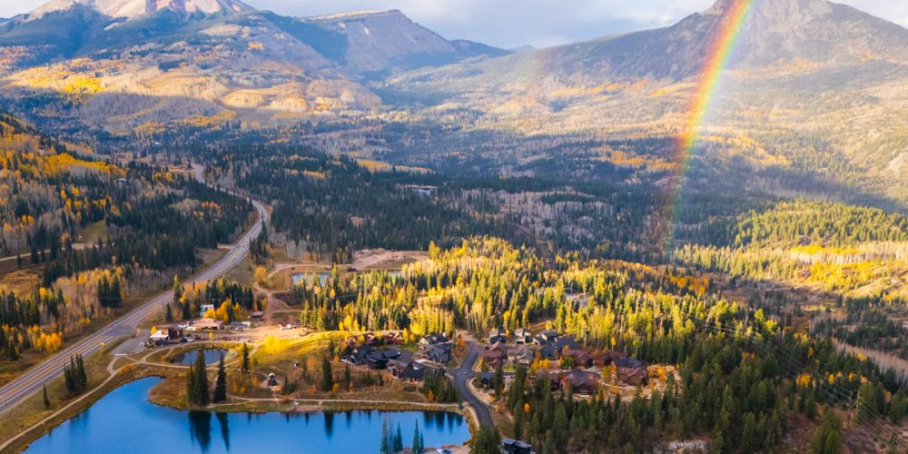 amazing drone shot of durango in colorado in fall with a blue lake