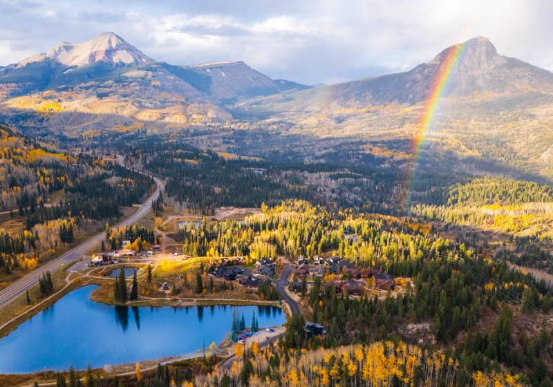 amazing drone shot of durango in colorado in fall with a blue lake