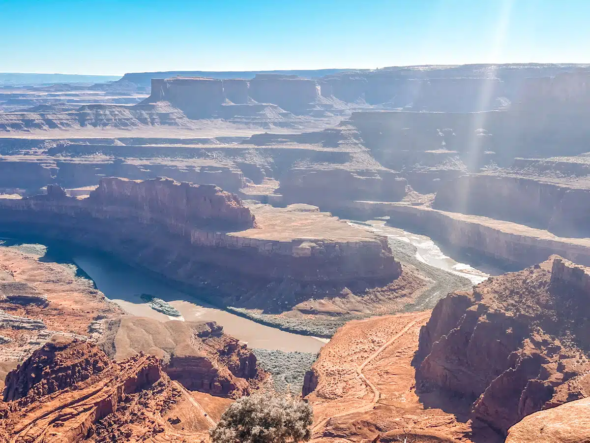 Wide view of the winding Colorado River and layered red rock canyons from Dead Horse Point